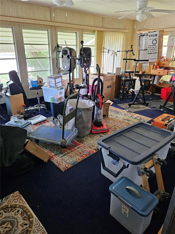 26080 Kings Road Bonita Springs, FL 34135 - Photo 4 of 10 a room with gym equipment and a large window