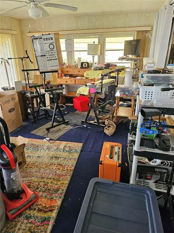 a room with lots of furniture and clutter