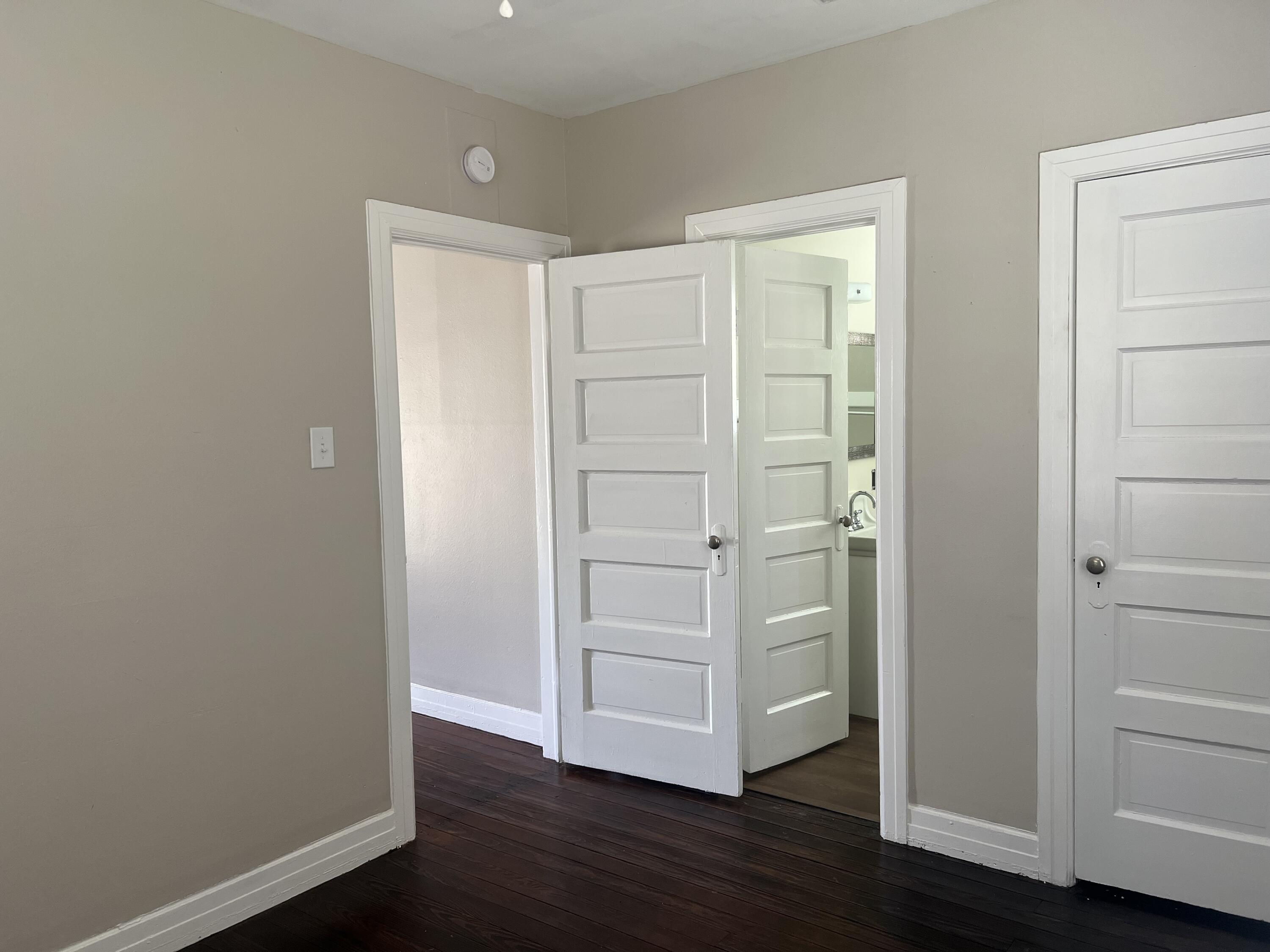 2202 28th Street, Unit B Lubbock, TX 79411 - Photo 15 of 17 an empty room with wooden floor