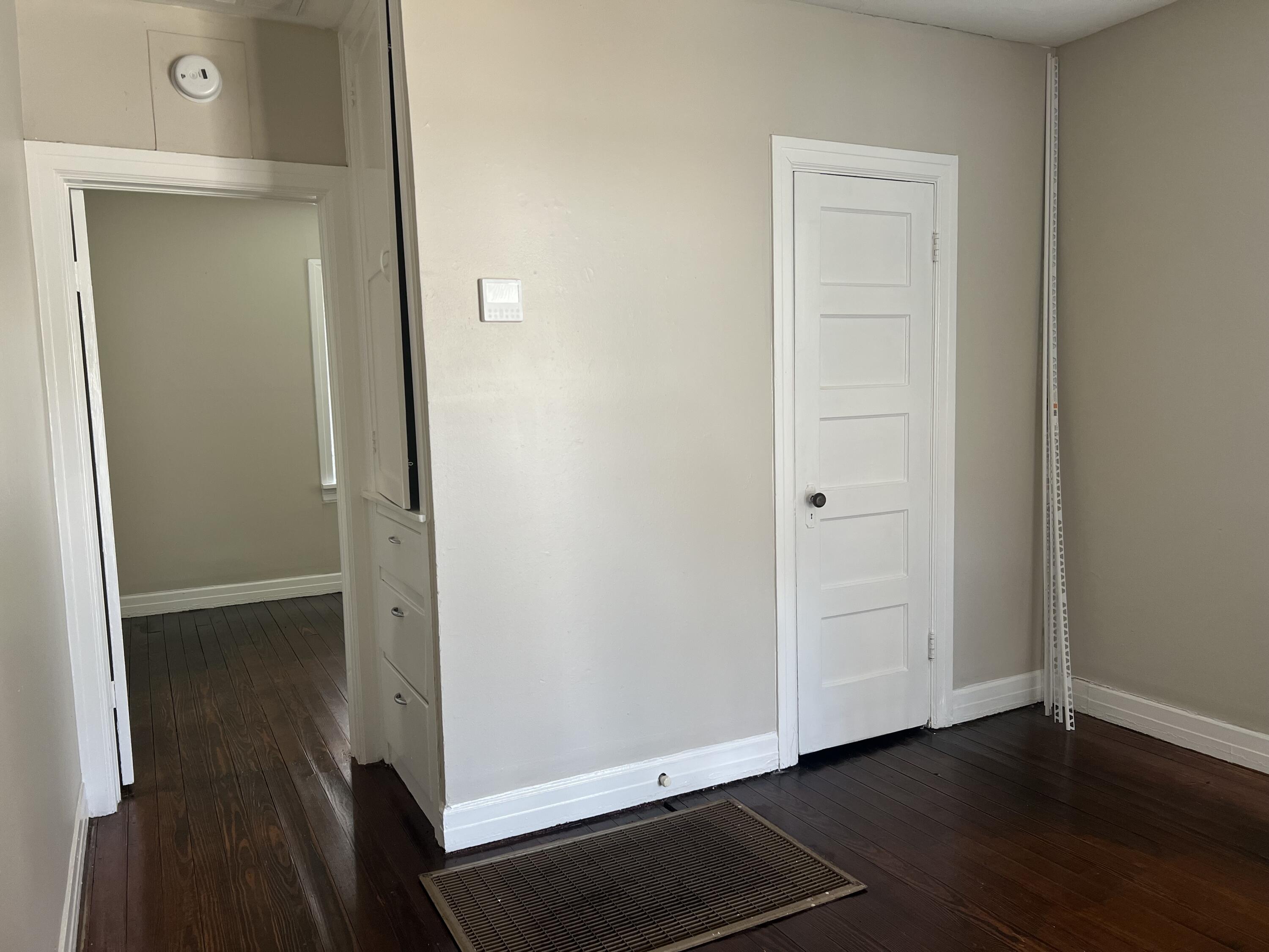 2202 28th Street, Unit B Lubbock, TX 79411 - Photo 8 of 17 an empty room with wooden floor