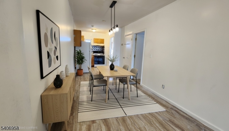 239 South 8th Street Newark, NJ 07103 - Photo 1 of 26 a dining room with furniture and window