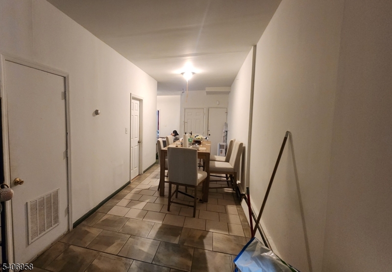 239 South 8th Street Newark, NJ 07103 - Photo 11 of 26 a view of a hallway with furniture and entryway