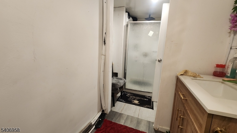 239 South 8th Street Newark, NJ 07103 - Photo 19 of 26 a room with storage and utility