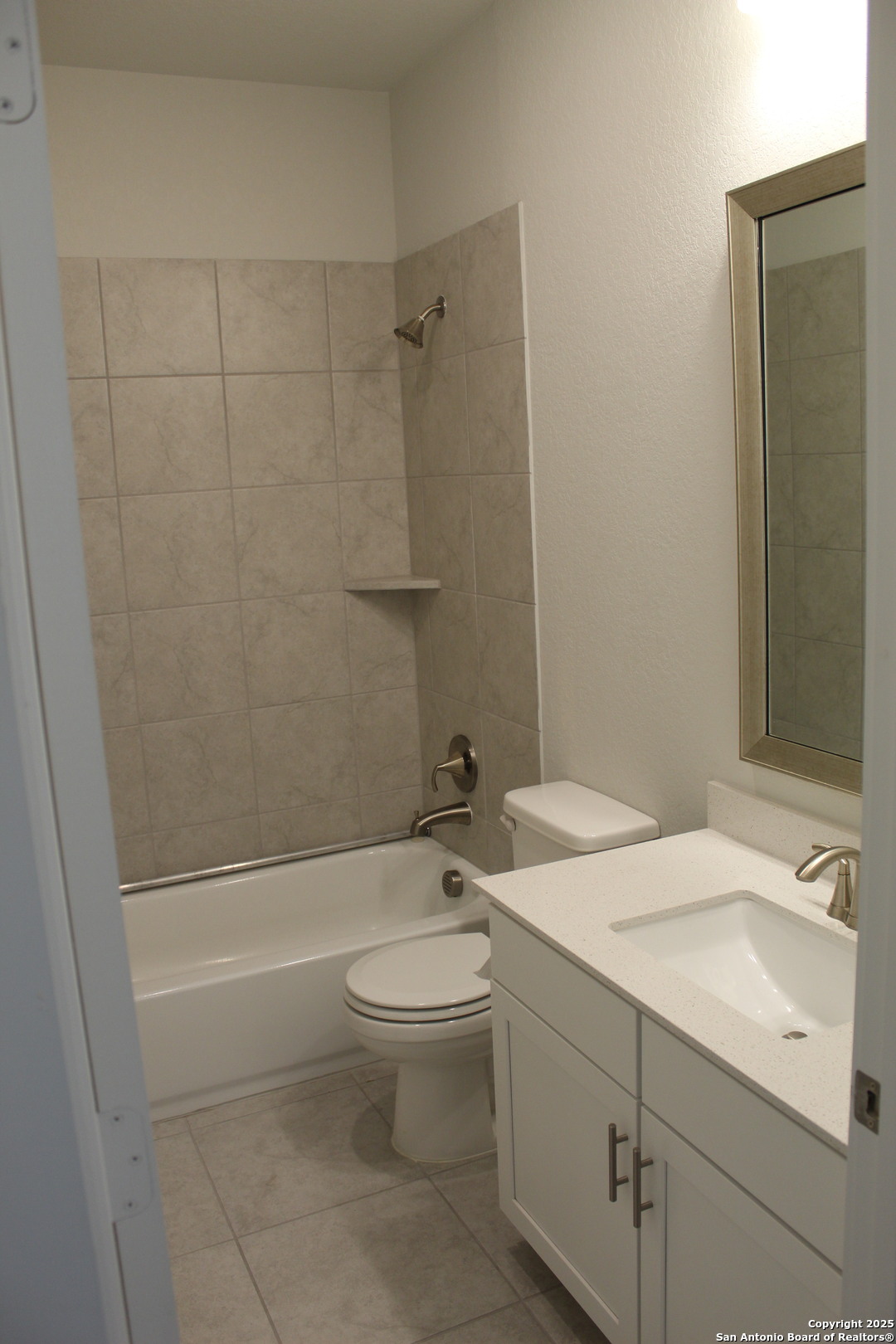 5843 Whitby Road, Unit 33 San Antonio, TX 78240 - Photo 11 of 15 a bathroom with a granite countertop sink toilet and shower