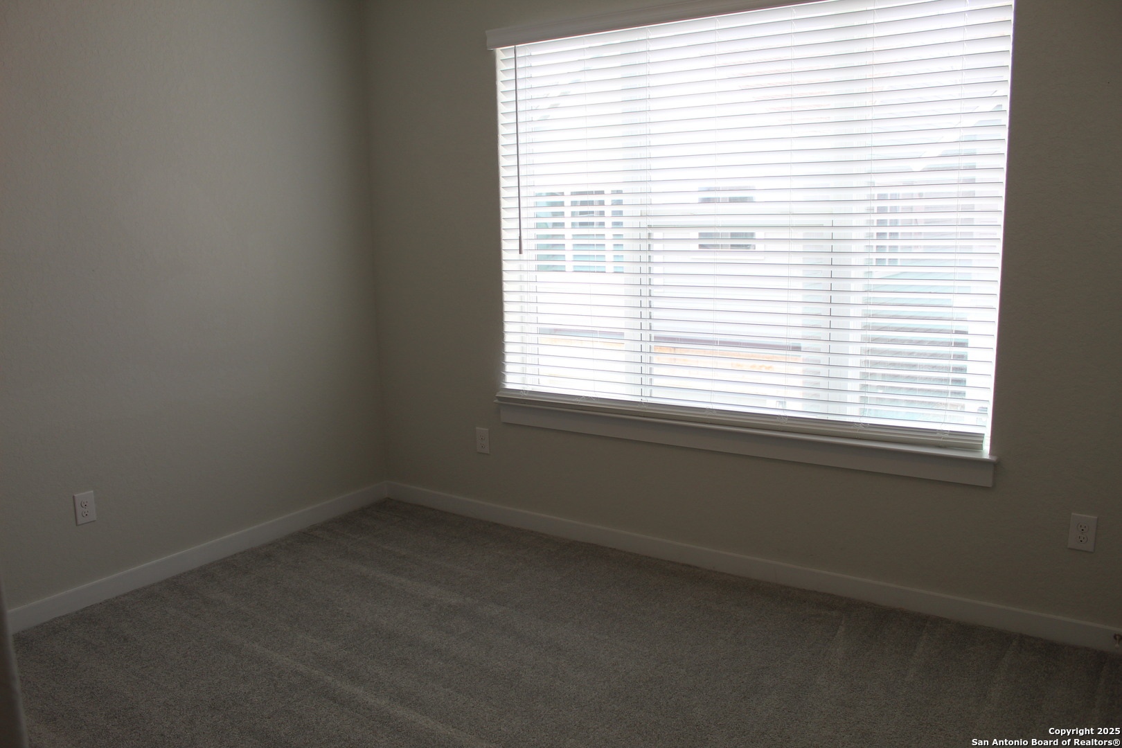 5843 Whitby Road, Unit 33 San Antonio, TX 78240 - Photo 13 of 15 a view of an empty room with a window