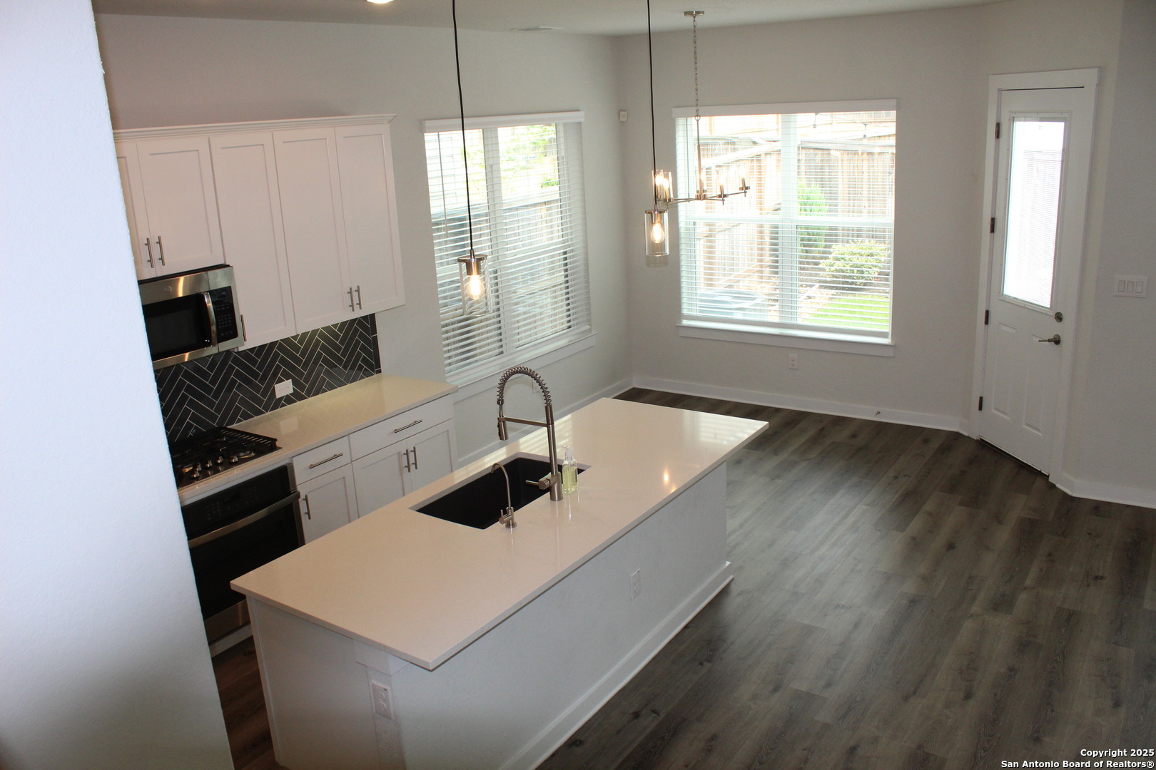 5843 Whitby Road, Unit 33 San Antonio, TX 78240 - Photo 3 of 15 a living room with hard wood floors and a sink