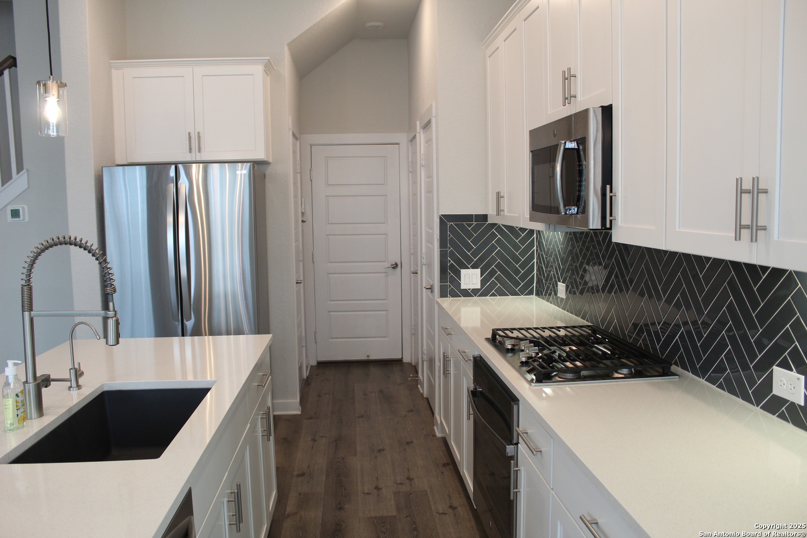 5843 Whitby Road, Unit 33 San Antonio, TX 78240 - Photo 5 of 15 a kitchen with a stove and a refrigerator