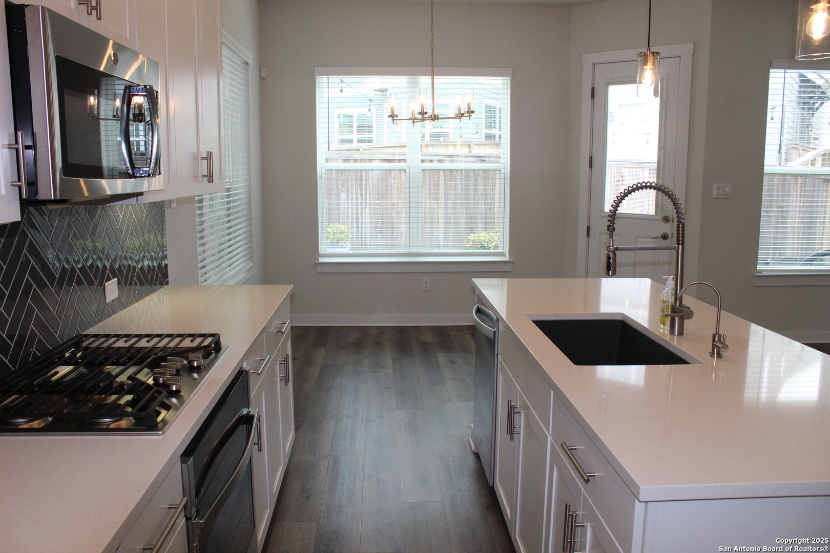 5843 Whitby Road, Unit 33 San Antonio, TX 78240 - Photo 6 of 15 a kitchen with a stove a sink and a window