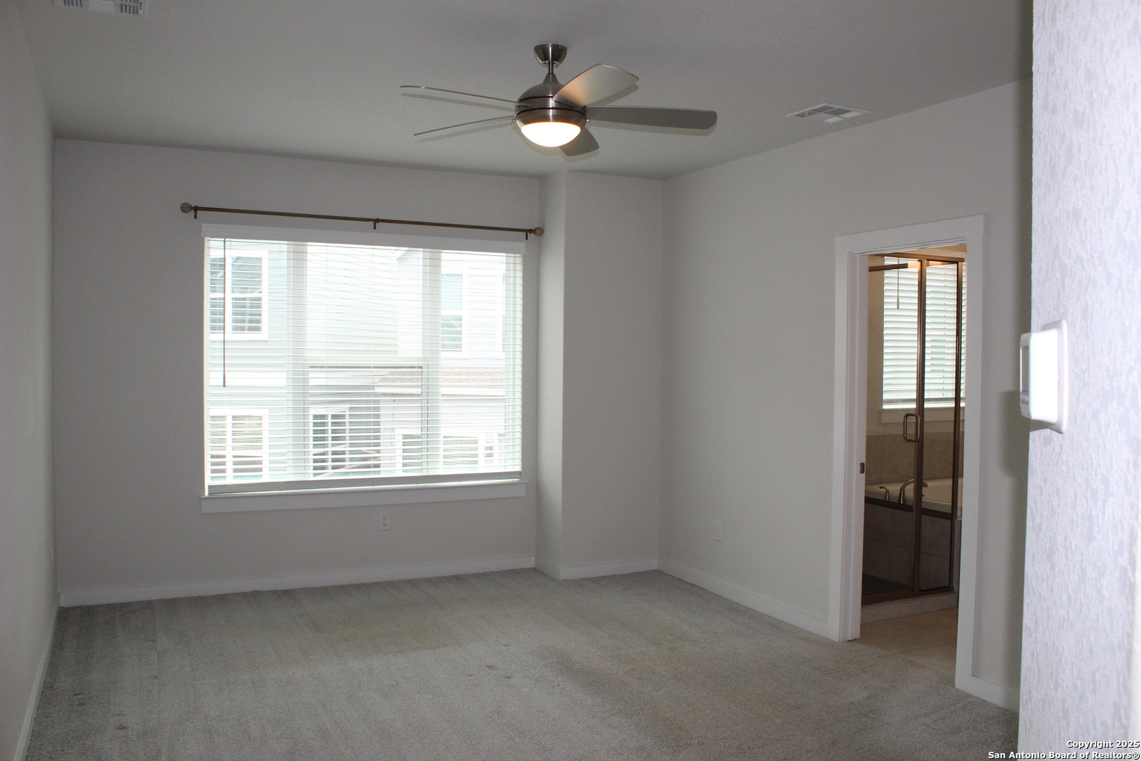 5843 Whitby Road, Unit 33 San Antonio, TX 78240 - Photo 8 of 15 a view of an empty room with a window