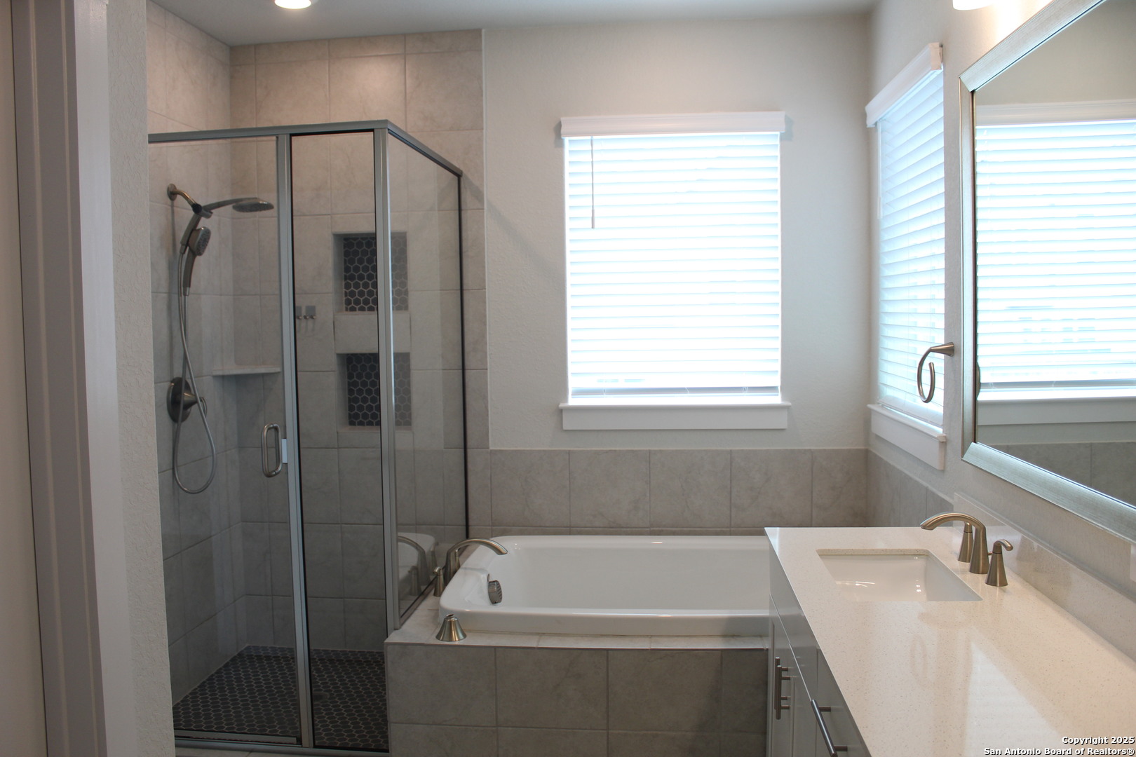 5843 Whitby Road, Unit 33 San Antonio, TX 78240 - Photo 9 of 15 a bathroom with a tub sink and window