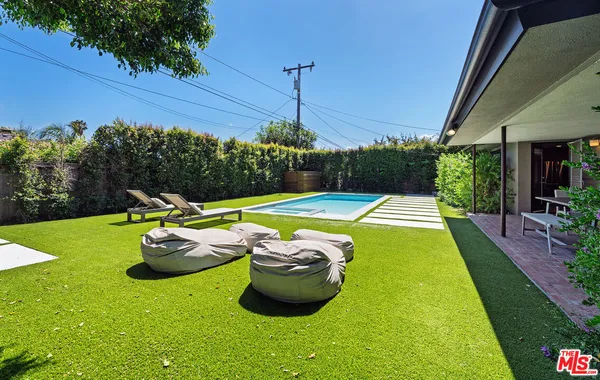 a view of swimming pool with a garden