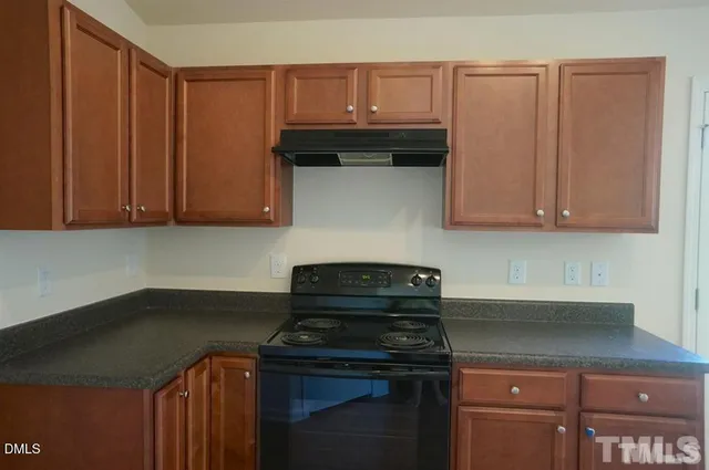 a sink sitting inside of a kitchen