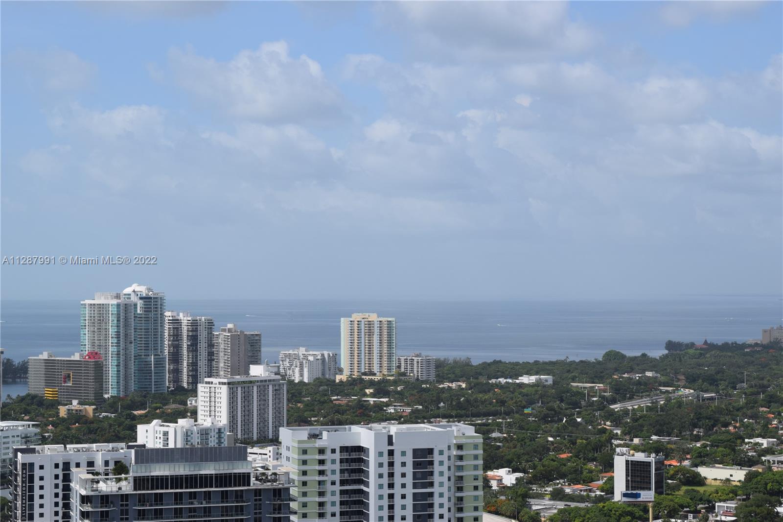 185 Southwest 7th Street, Unit 4014 Miami, FL 33130 - Photo 4 of 21 a view of a city with tall buildings in the background