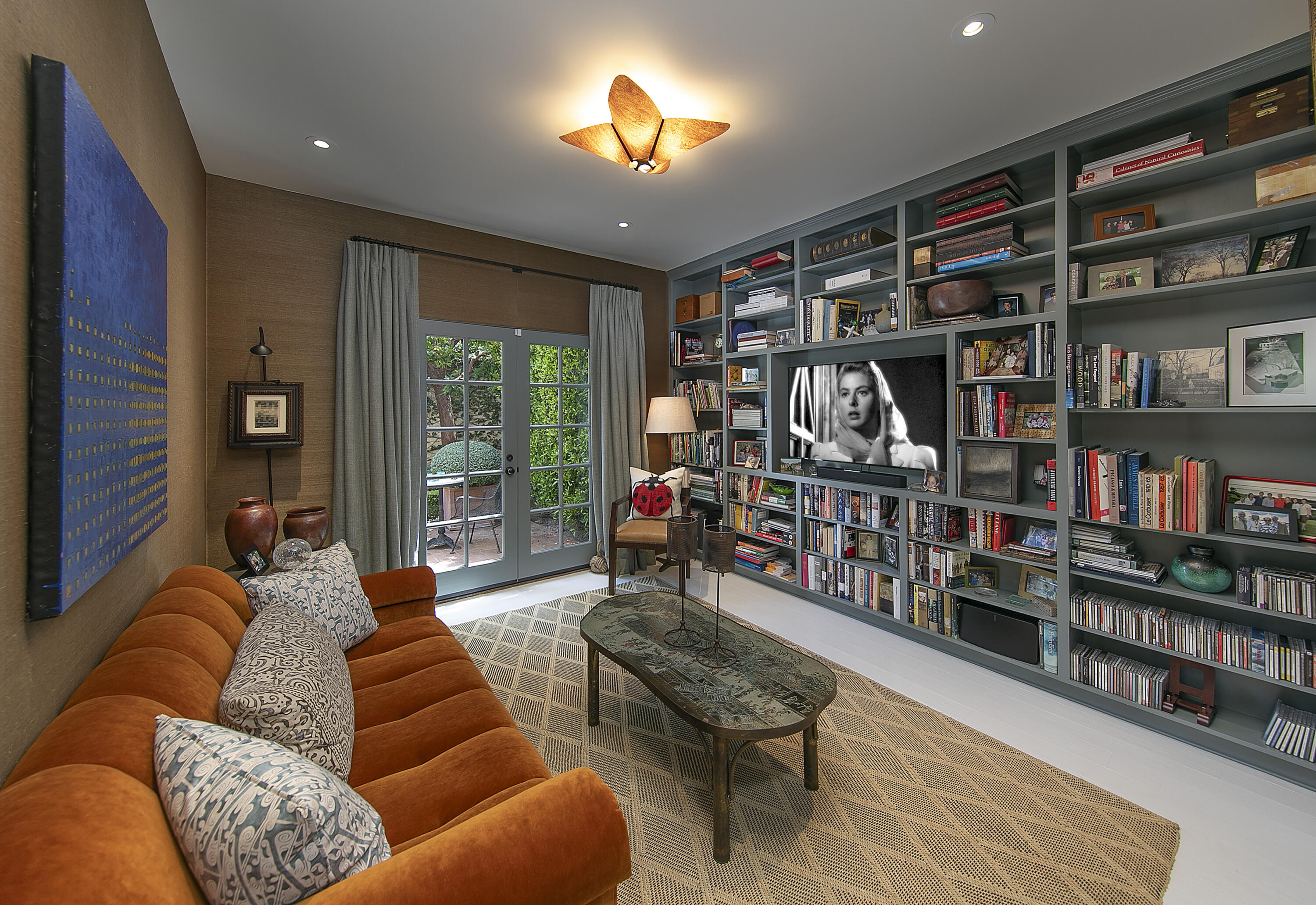 85 Depot Road Montecito, CA 93108 - Photo 10 of 14 a living room with furniture a bookshelf and a book shelf