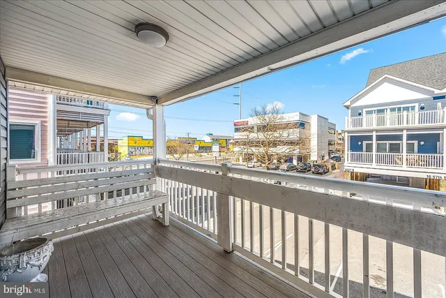a view of a balcony with wooden floor
