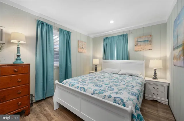 a bedroom with a bed and a dresser