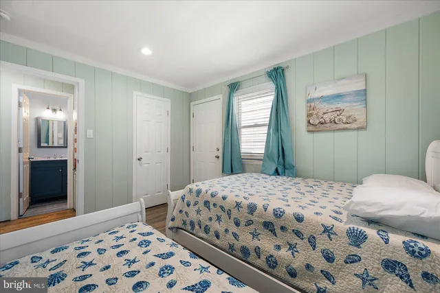 a bedroom with a large bed and a dresser