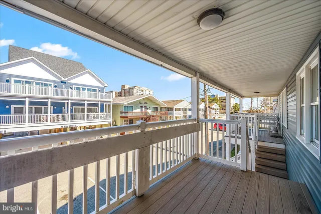 a view of a balcony with wooden floor