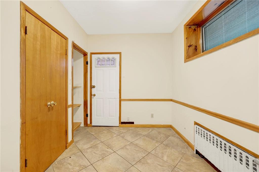2602 Avenue T Brooklyn, NY 11229 - Photo 20 of 27 a view of a hallway with wooden walls