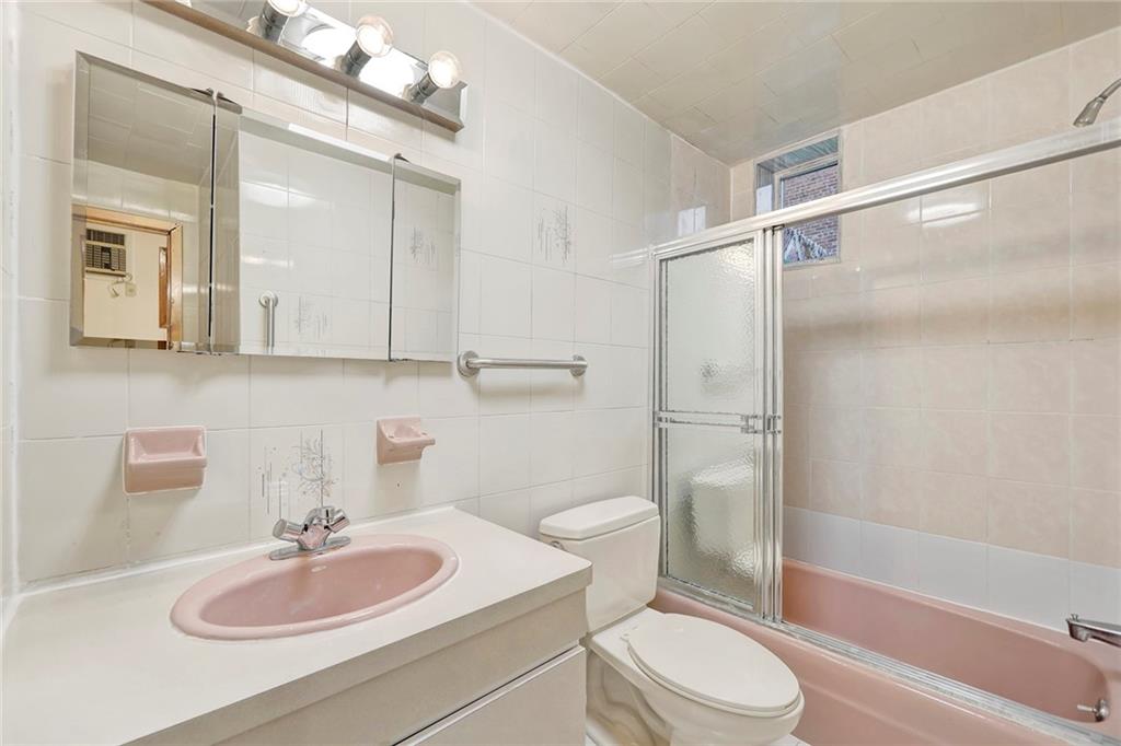 2602 Avenue T Brooklyn, NY 11229 - Photo 21 of 27 a bathroom with a sink toilet vanity and shower