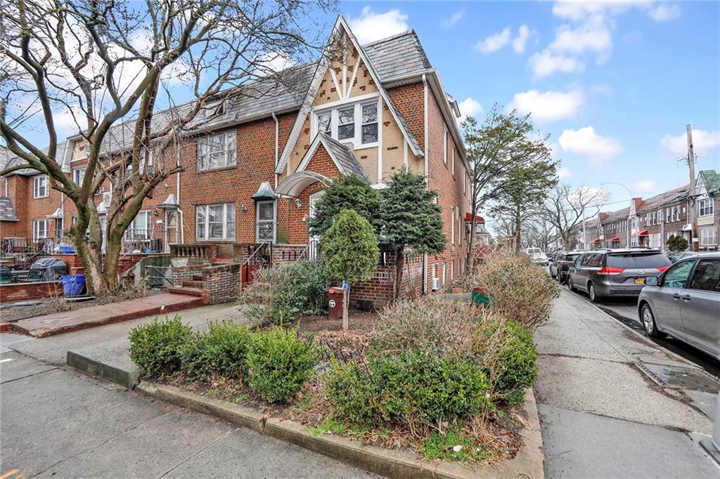 2602 Avenue T Brooklyn, NY 11229 - Photo 24 of 27 a view of a house with a cars park side of a road