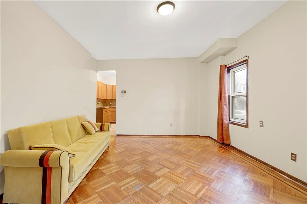 2602 Avenue T Brooklyn, NY 11229 - Photo 3 of 27 a bedroom with a bed and wooden floor