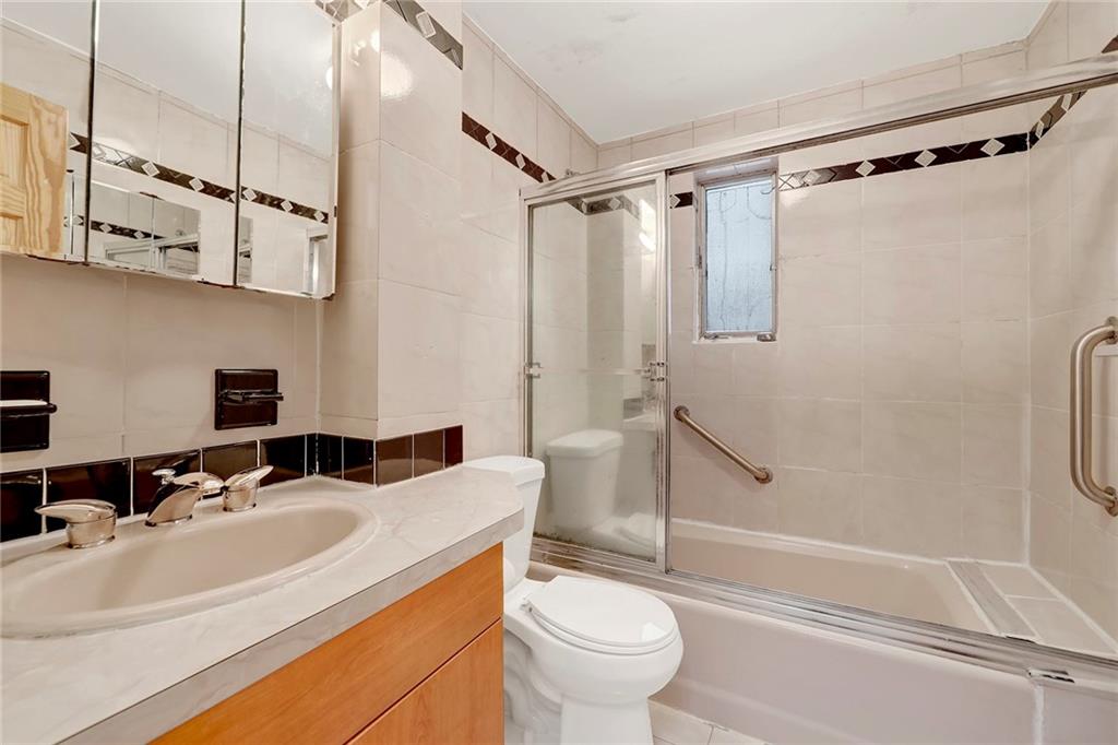 2602 Avenue T Brooklyn, NY 11229 - Photo 9 of 27 a bathroom with a sink toilet and shower