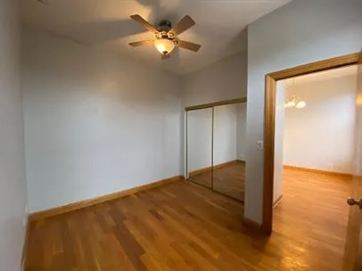 a view of empty room with a ceiling fan