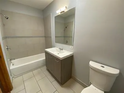 a bathroom with a sink a toilet and bathtub