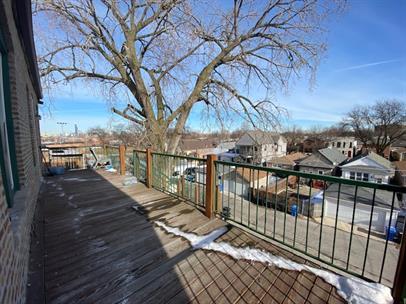 4221 South Union Avenue, Unit 3 Chicago, IL 60609 - Photo 16 of 16 a view of balcony with wooden floor and fence