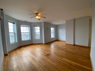 4221 South Union Avenue, Unit 3 Chicago, IL 60609 - Photo 3 of 16 a view of an empty room with window and wooden floor