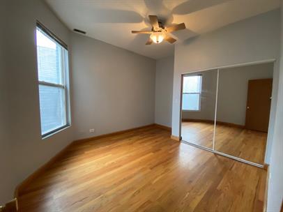 4221 South Union Avenue, Unit 3 Chicago, IL 60609 - Photo 7 of 16 an empty room with windows and closet