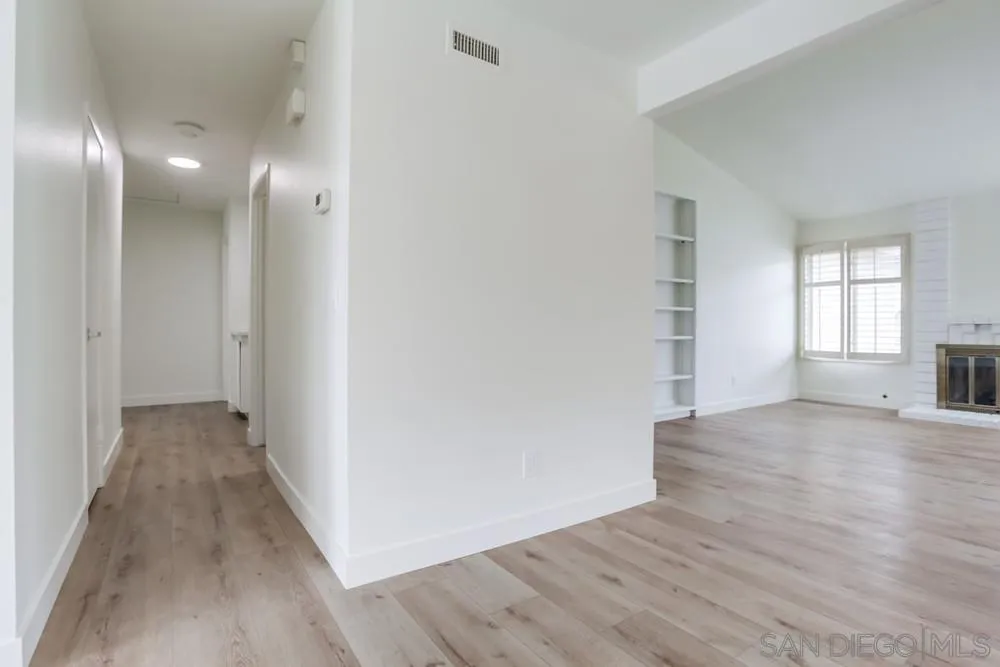 384 Compass Road Oceanside, CA 92054 - Photo 13 of 34 wooden floor in an empty room with a window
