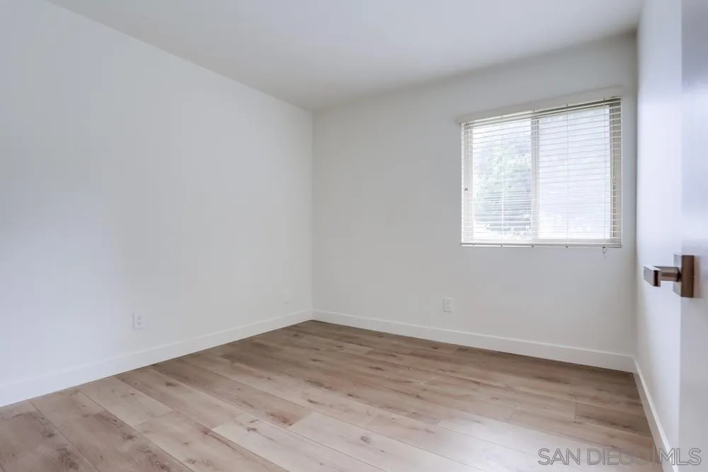 384 Compass Road Oceanside, CA 92054 - Photo 24 of 34 wooden floor in an empty room with a window