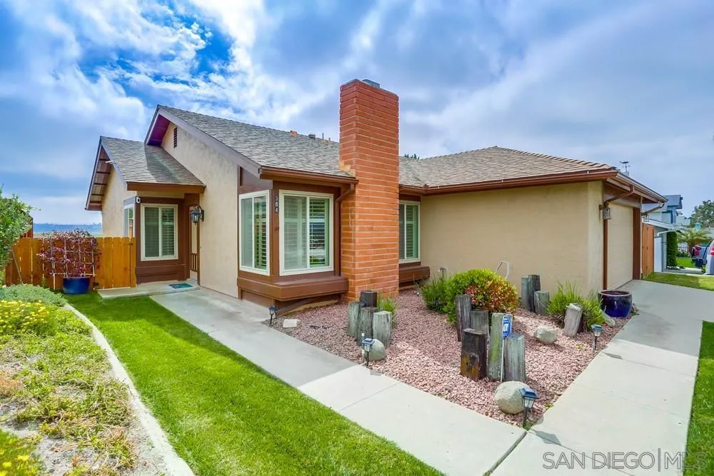 384 Compass Road Oceanside, CA 92054 - Photo 34 of 34 a front view of a house with garden