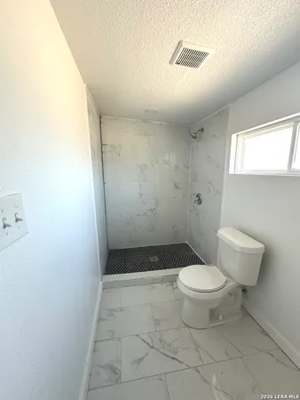 a bathroom with a toilet