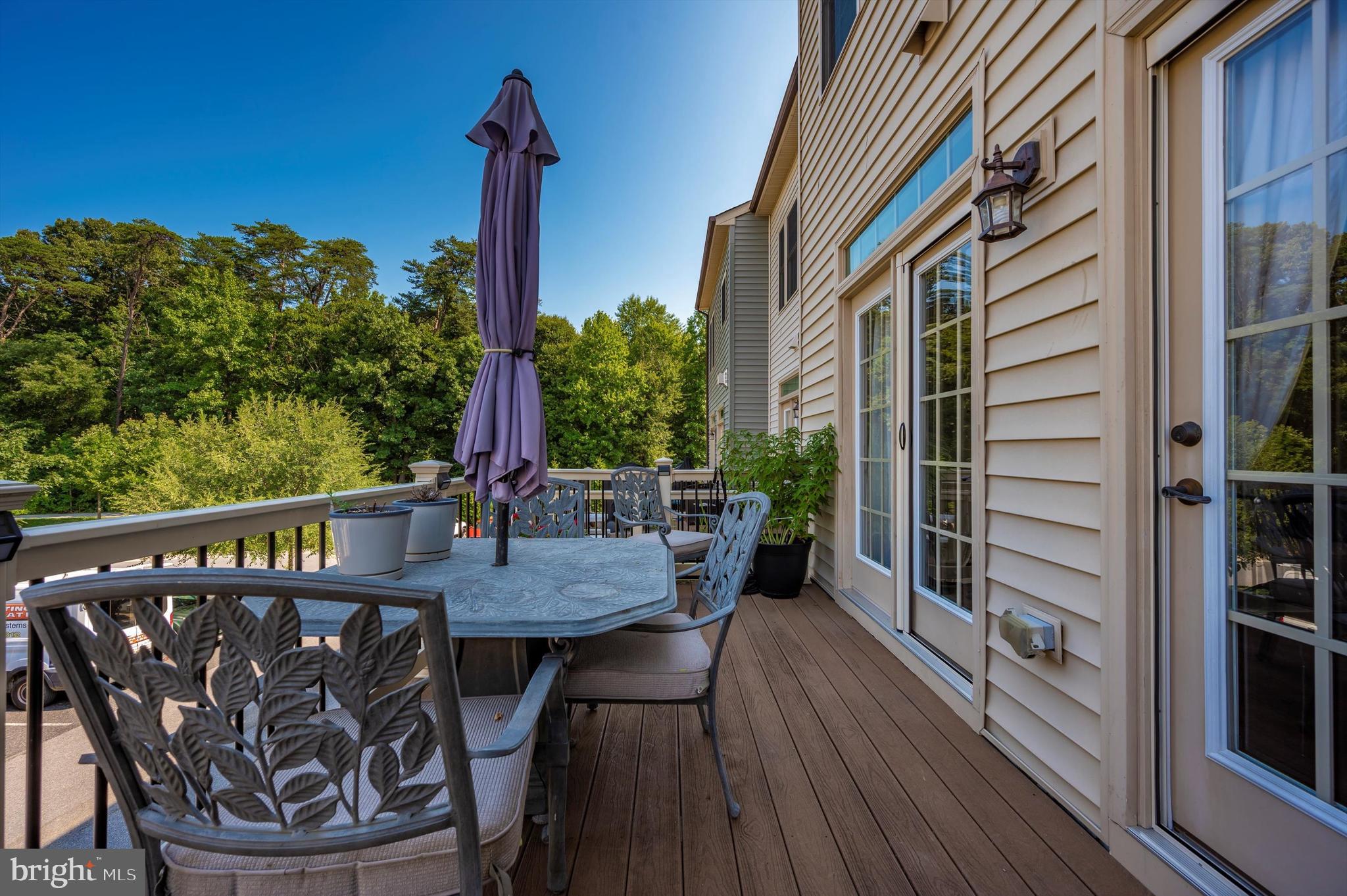 7407 Matapan Drive Hanover, MD 21076 - Photo 25 of 29 Deck overlooks green space and hiking trail.