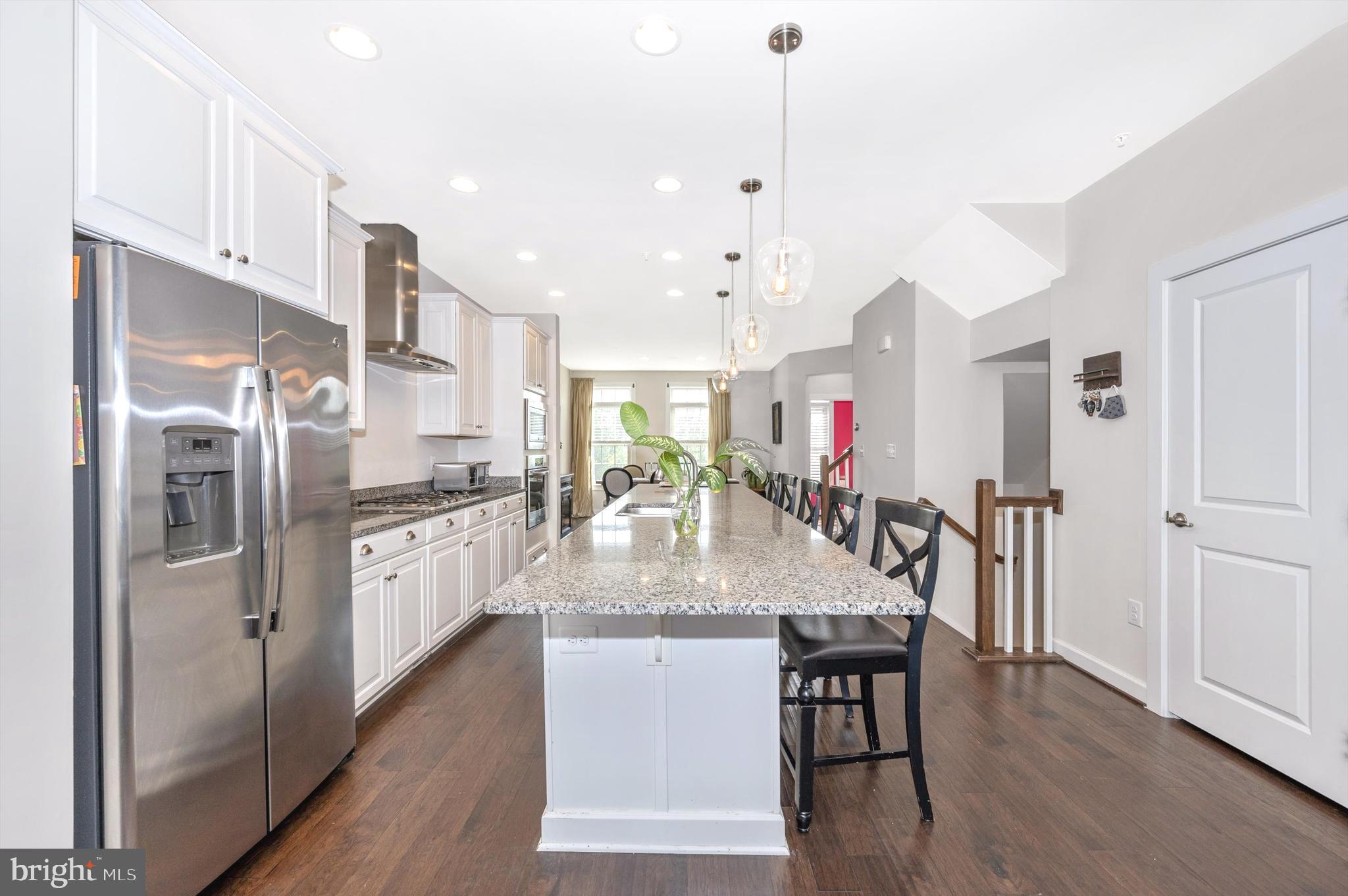 7407 Matapan Drive Hanover, MD 21076 - Photo 6 of 29 Massive island with high-gloss granite, pendants.