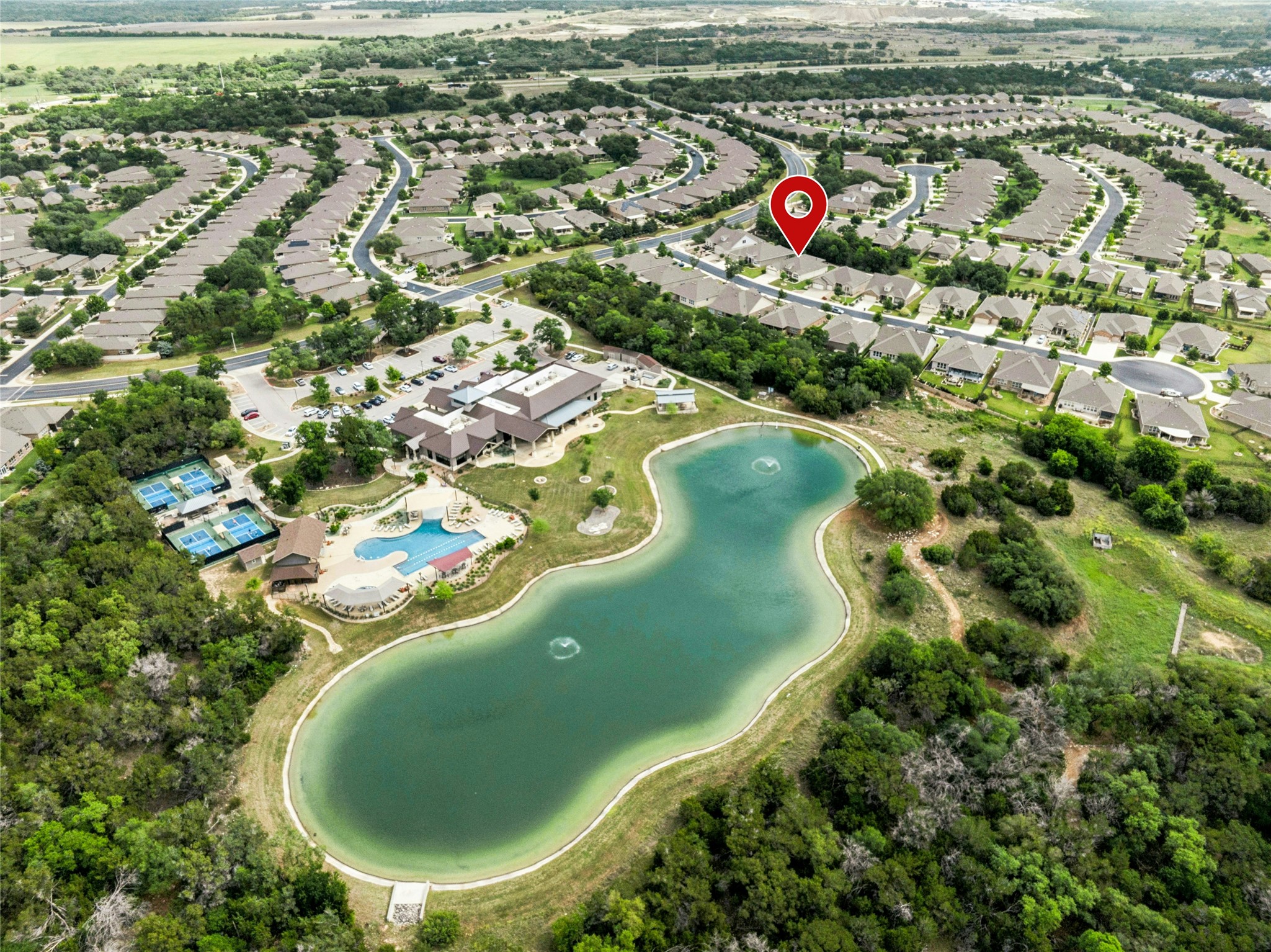 105 Marfa Cove Georgetown, TX 78633 - Photo 34 of 36 an aerial view of a swimming pool with a yard