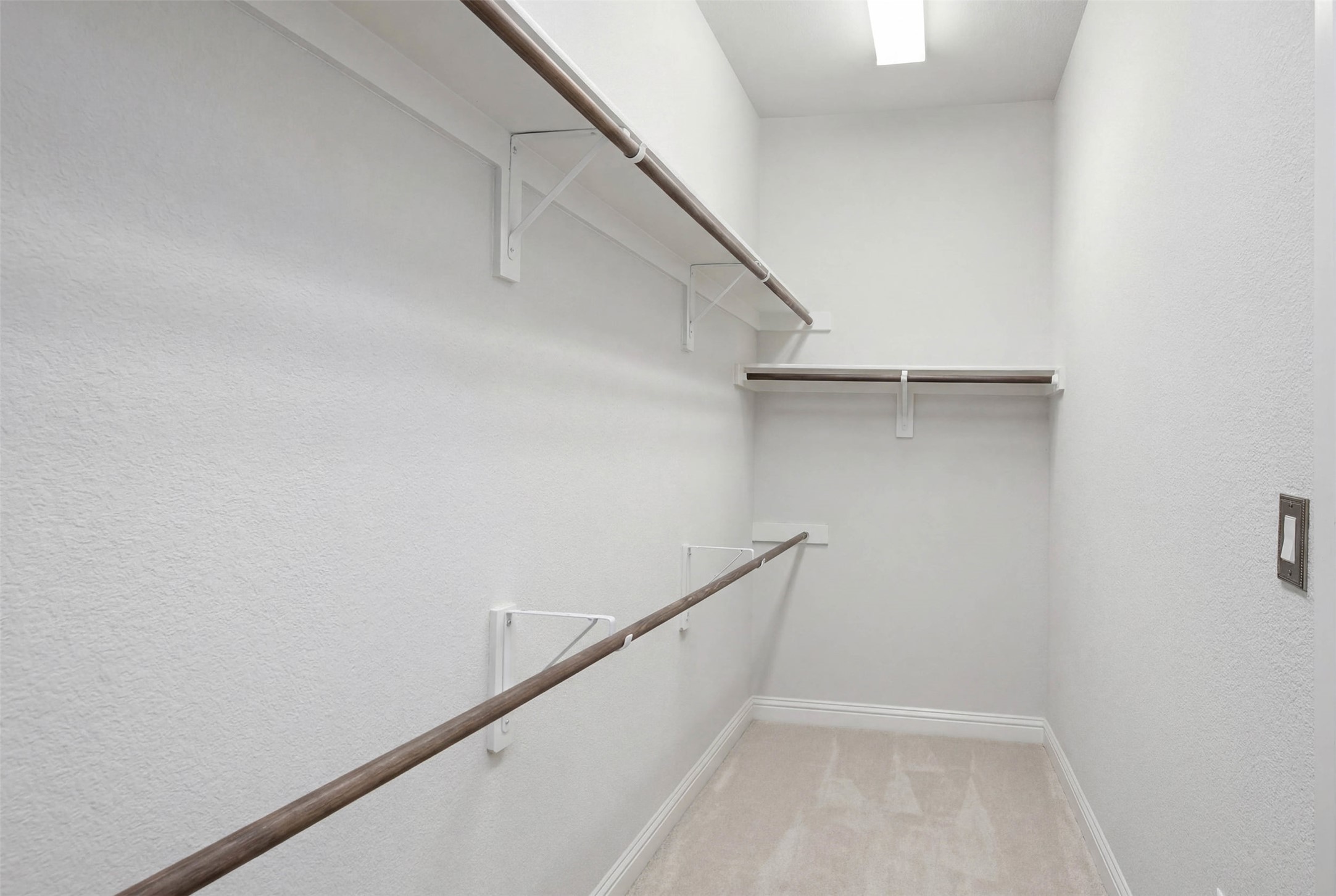 1113 Modoc Way Kyle, TX 78640 - Photo 18 of 34 Ample hanging space and shelving define this bright, functional walk-in closet.