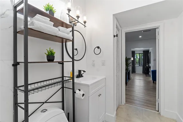 a view of a hallway with paintings on the wall