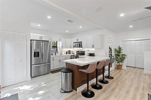 a kitchen with counter space and stainless steel appliances
