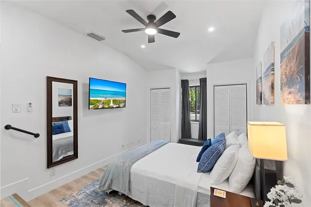 a bedroom with a bed and a lamp on table