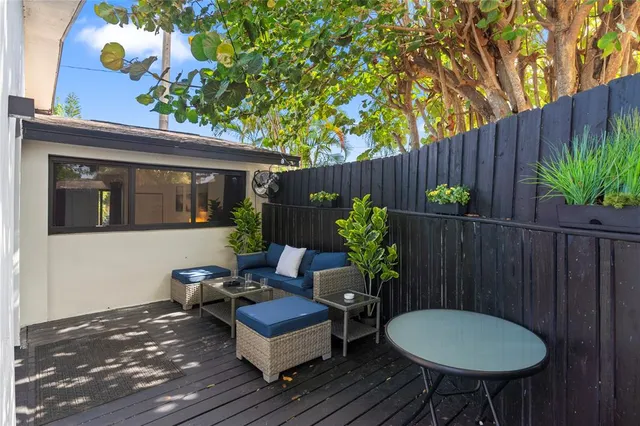 a view of a backyard with furniture