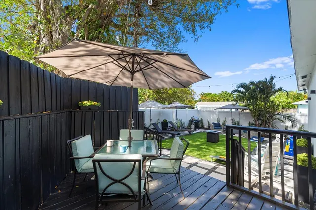 a view of a table and chairs on the roof deck