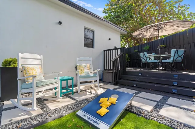a living room with furniture and a rug