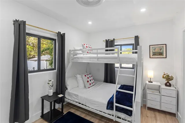 a bedroom with furniture and a window