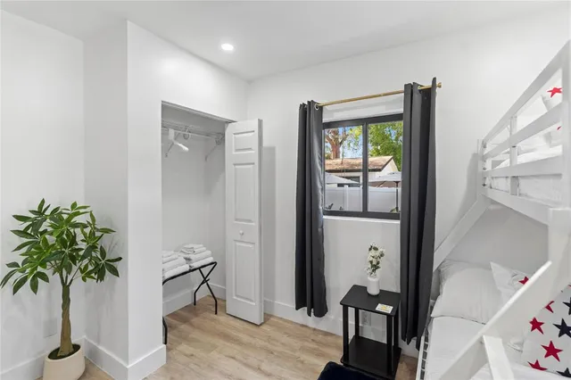 a view of entryway with wooden floor and front door