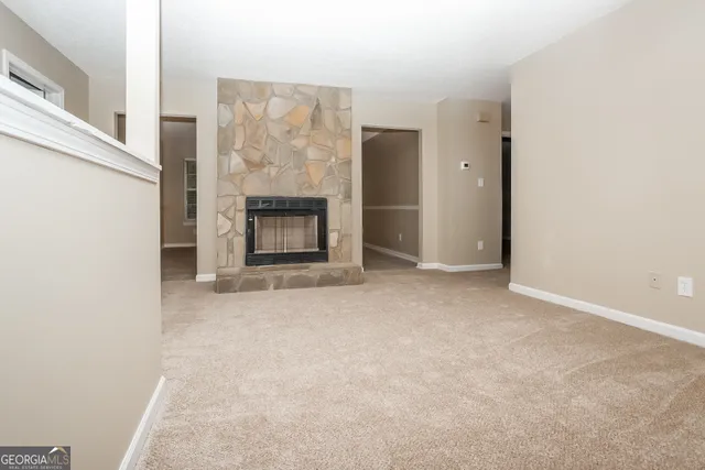 an empty room with a fireplace