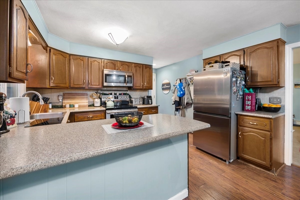 63 Hebb Street Somerset, MA 02725 - Photo 11 of 30 a kitchen with refrigerator and a sink